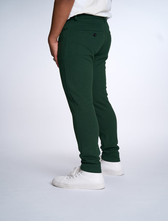 Person wearing Dapper Boi slim casual knit pants in green, back view