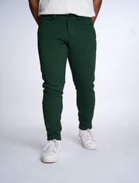 Person wearing Dapper Boi slim casual knit pants in green, front view